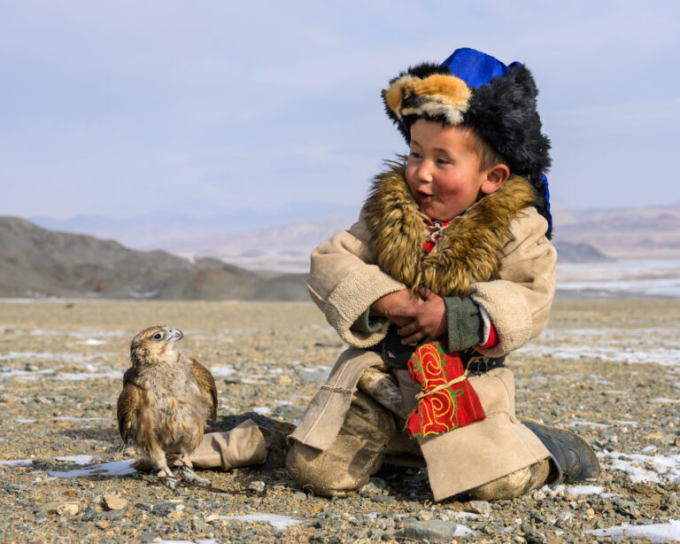 Kazakh boy and his Saker falcon in Mongolia