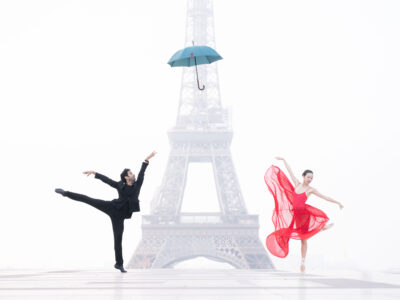 Dancers in front of the Eiffel Tower in Paris