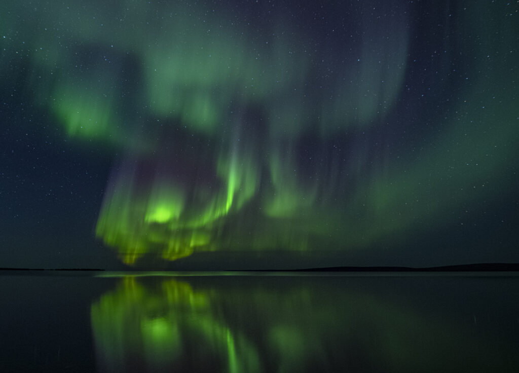 Aurora curls in the night sky of Yellowknife