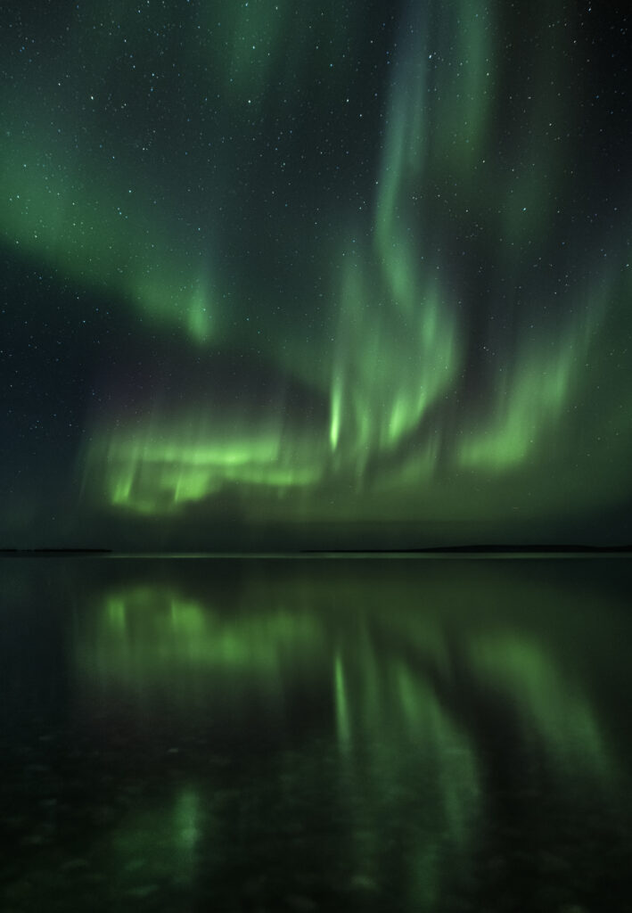 Reflections of the northern lights in Northern Canada