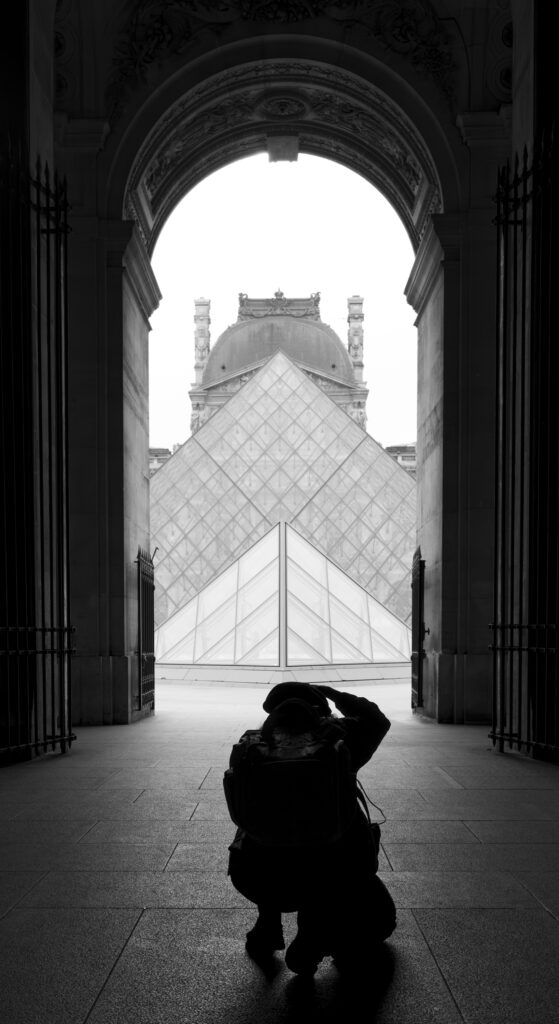 Photographer at Le Louvre during the day