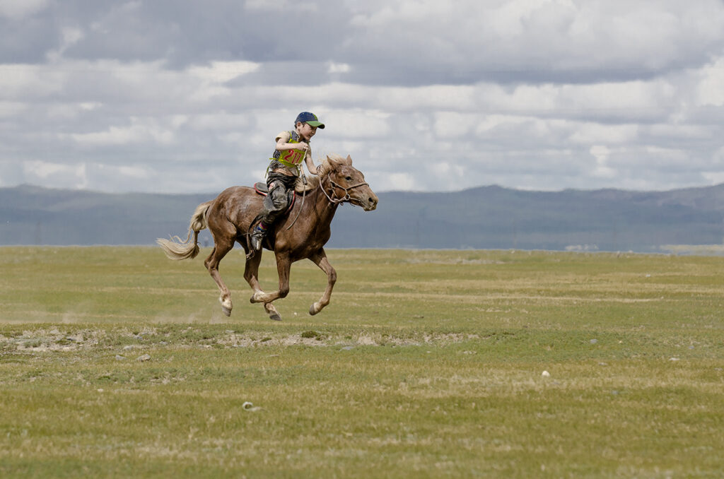 Mongolia child horse racing at Naadam Festival