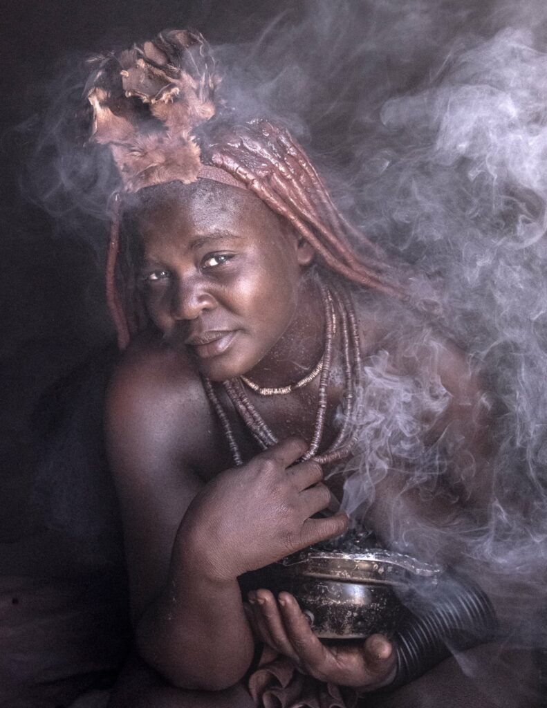 Himba woman taking a smoke bath